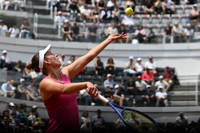 Belgium's Elise Mertens serves to Italy's Jasmine Paolini during the WTA Rome Open tennis tournament at Foro Italico in Rome on May 9, 2026.   Tiziana FABI / AFP