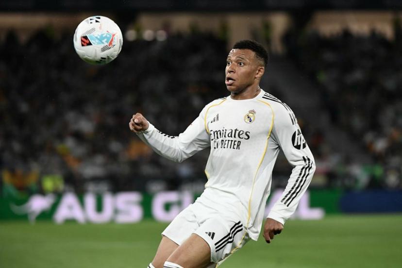 Real Madrid's French forward #10 Kylian Mbappe controls the ball during the Spanish league football match between Real Betis and Real Madrid CF at the La Cartuja stadium in Seville on April 24 , 2026.  CRISTINA QUICLER / AFP