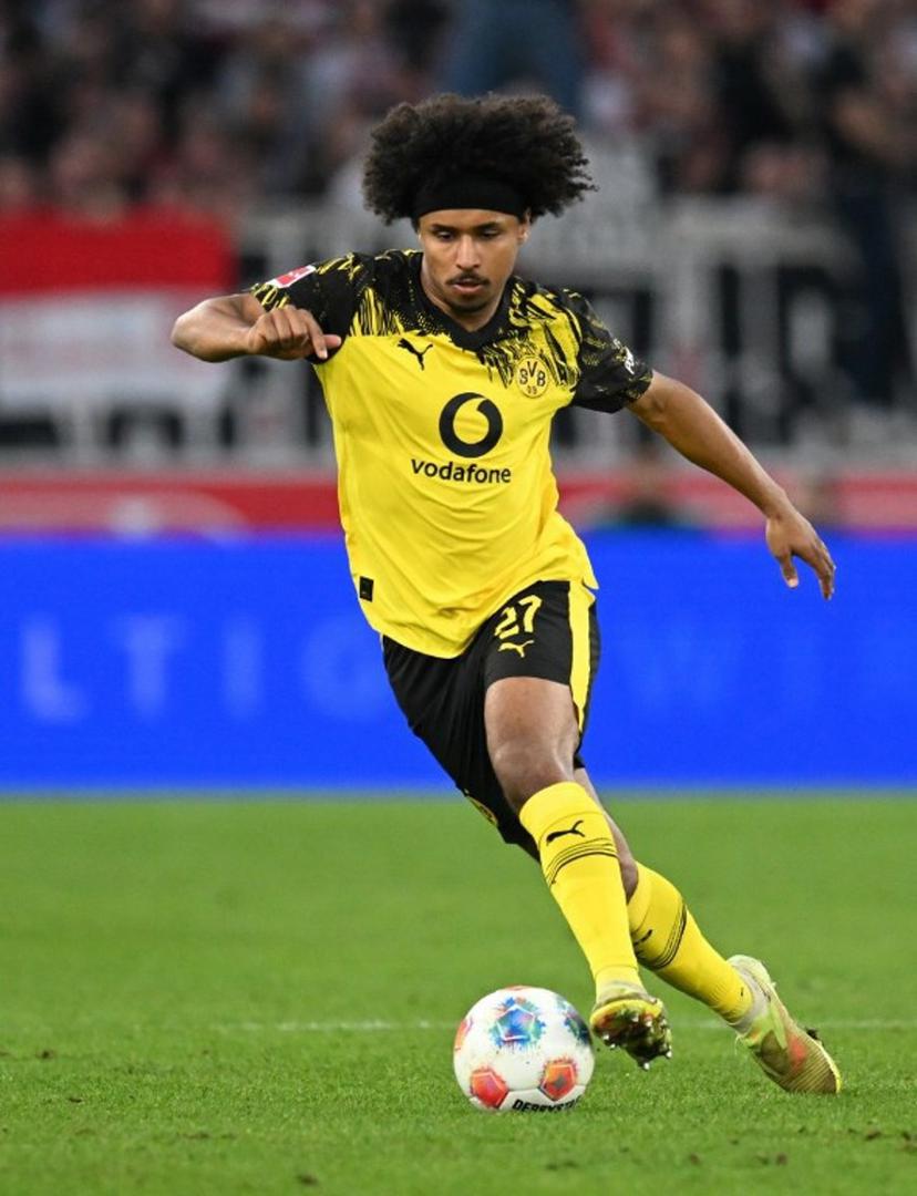 Dortmund's German forward #27 Karim Adeyemi plays the ball during the German first division Bundesliga football match between VfB Stuttgart and BVB Borussia Dortmund in Stuttgart, southern Germany, on April 4, 2026.  THOMAS KIENZLE / AFP