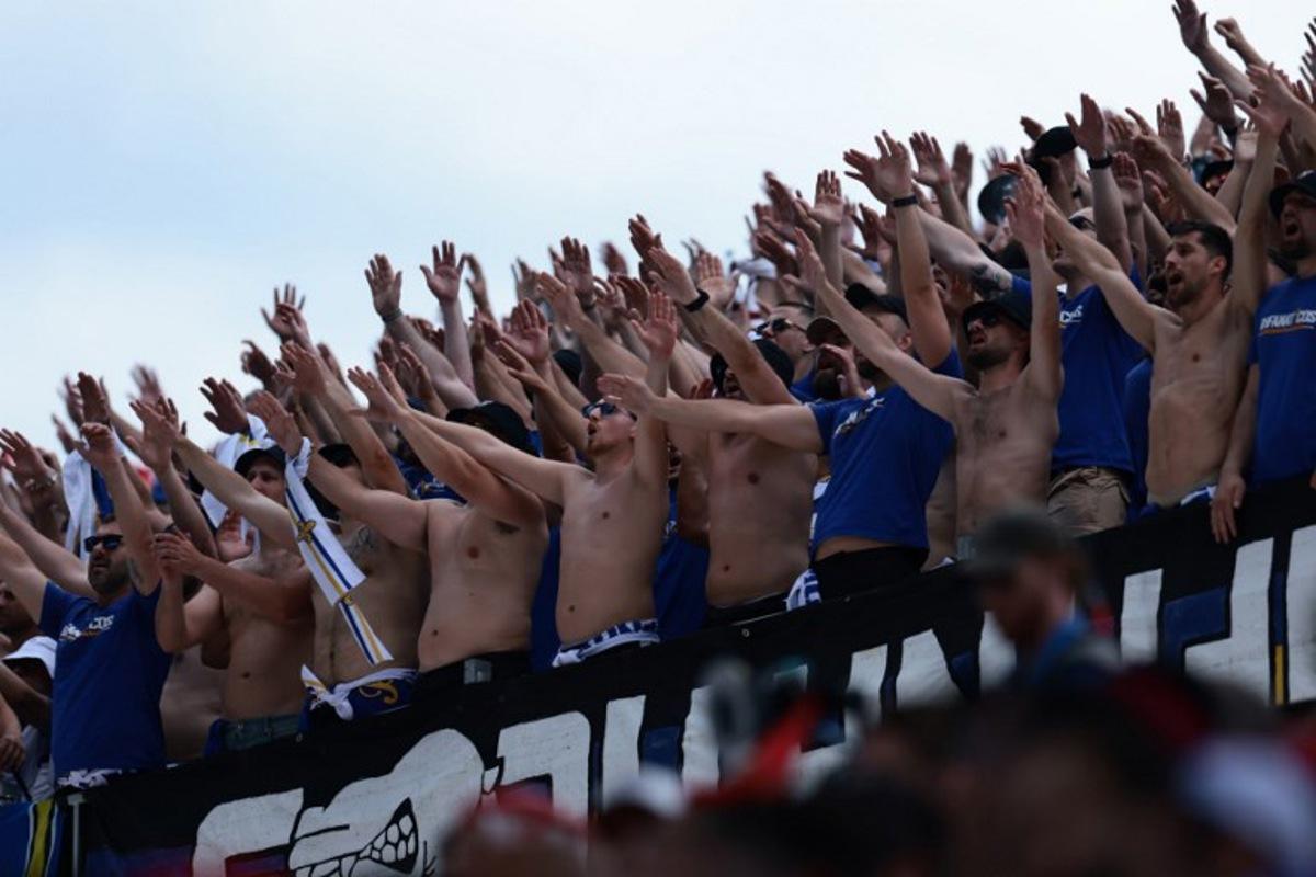 Bosnia and Herzegonvina's supporters cheer their team during the 2026 World Cup Group B football match between Canada and Bosnia and Herzegovina at the Toronto Stadium in Toronto on June 12, 2026.  Cole Burston / AFP