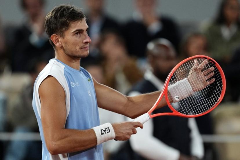 Italy's Matteo Arnaldi reacts to his victory after Italy's Matteo Berrettini withdrawn due to an injury at the end of their men's quarter final singles match on day 11 of the French Open tennis tournament on Court Philippe-Chatrier at the Roland-Garros Complex in Paris on June 3, 2026.  Dimitar DILKOFF / AFP