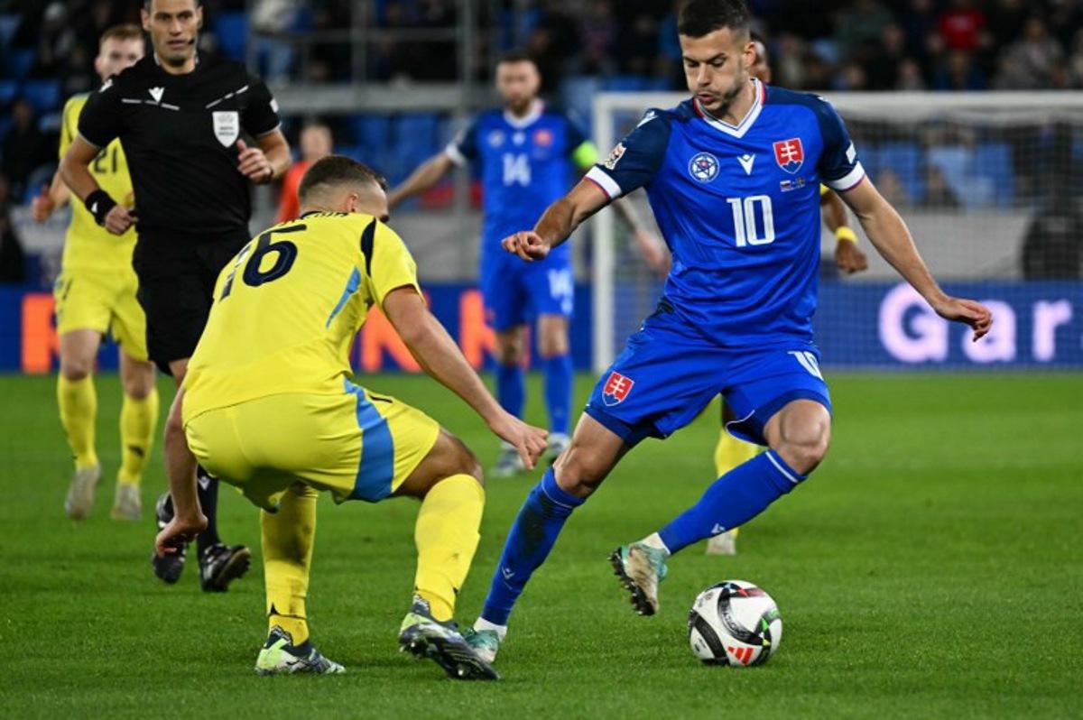 Slovakia's midfielder #10 Laszlo Benes (R) and Sweden's midfielder #16 Jesper Karlstroem vie for the ball during the UEFA Nations League, League C Group C1 football match  Slovakia vs Sweden, in Bratislava on October 11, 2024.  Joe Klamar / AFP