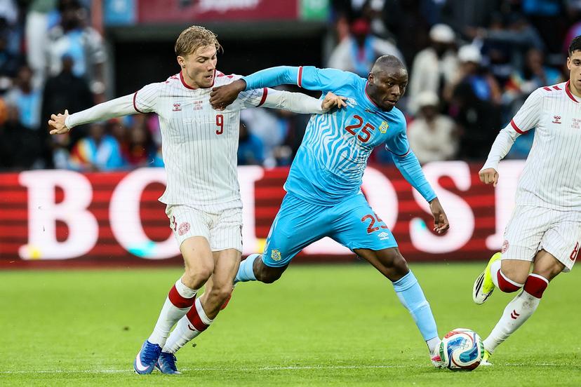 Danish Rasmus Hojlund and Congolese Edo Kayembe fight for the ball during a friendly soccer game between the national teams of DR Congo and Denmark, Wednesday 03 June 2026 in Liege, in preparation of the upcoming the 2026 World Cup. BELGA PHOTO BRUNO FAHY