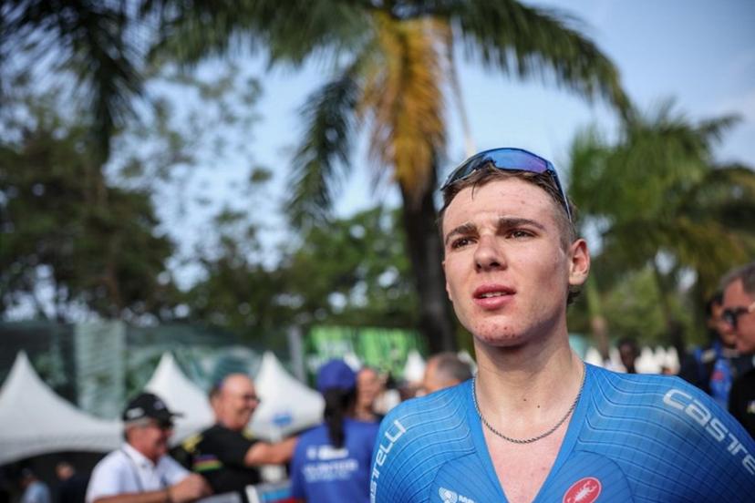 Italian rider Lorenzo Mark Finn reacts after winning the men's U23 road race cycling event during the UCI 2025 Road World Championships, in Kigali, on September 26, 2025.  Anne-Christine POUJOULAT / AFP