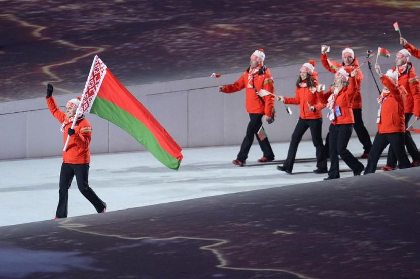 Belarus' flag bearer, freestyle skier Aleksei Grishin leads his national delegation during the Opening Ceremony of the Sochi Winter Olympics at the Fisht Olympic Stadium on February 7, 2014 in Sochi. AFP PHOTO / JONATHAN NACKSTRAND  Jonathan NACKSTRAND / AFP