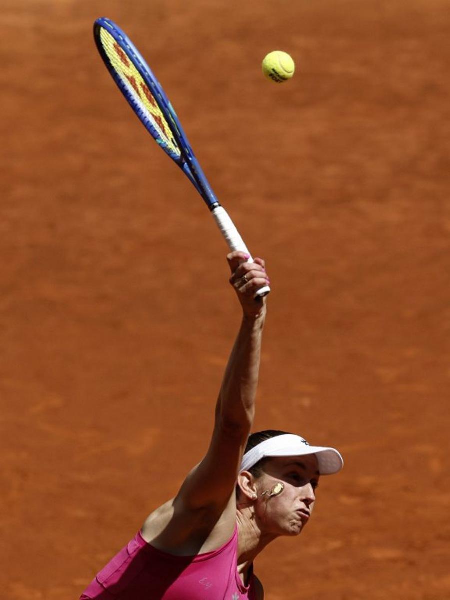 Belgium's Elise Mertens serves to Czech Republic's Karolina Pliskova during their 2026 WTA Tour Madrid Open tennis tournament singles match at the Caja Magica in Madrid, on April 26, 2026.   OSCAR DEL POZO / AFP