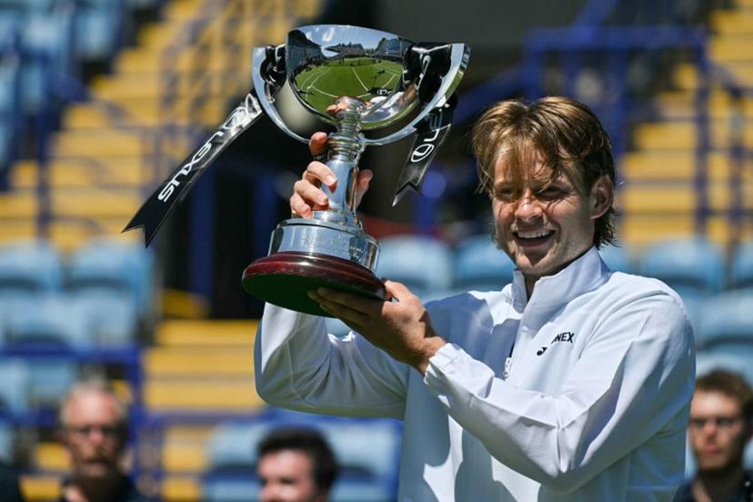 Belgium's Zizou Bergs poses with the winner's trophy after beating France's Ugo Humbert in their men's final tennis match on day seven of the Lexus Eastbourne Open at Devonshire Park, Eastbourne, on the south coast of England on June 28, 2026.  Glyn KIRK / AFP