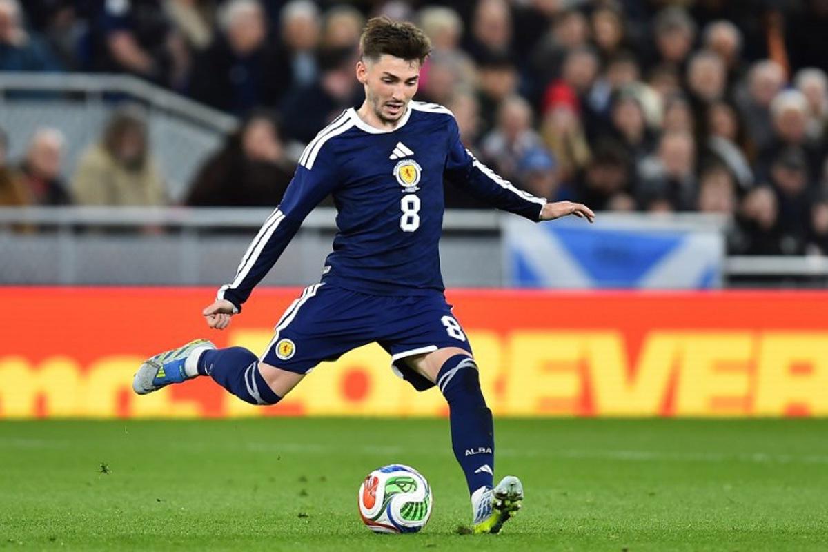 Scotland's midfielder #08 Billy Gilmour passes the ball during the friendly international football match between Scotland and Ivory Coast at the Hill Dickinson Stadium in Liverpool, north west England on March 31, 2026.    PETER POWELL / AFP