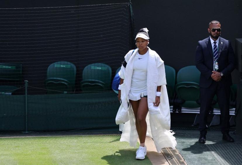 Japan's Naomi Osaka walks out before her women's singles third round tennis match against Australia's Daria Kasatkina on the fifth day of the 2026 Wimbledon Championships at The All England Lawn Tennis and Croquet Club in Wimbledon, southwest London, on July 3, 2026.  Henry NICHOLLS / AFP