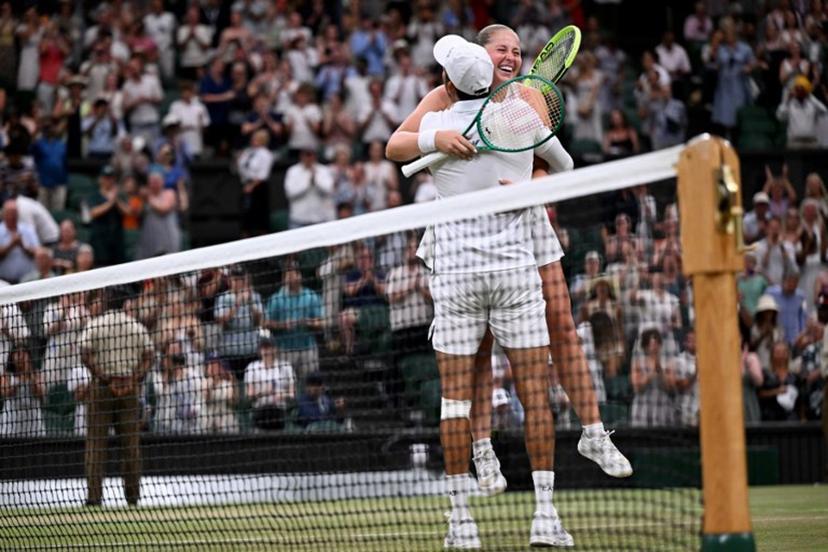 El Salvador's Marcelo Arevalo and Latvia's Jelena Ostapenko celebrate winning against Australia's players Marc Polmans and Storm Hunter during their mixed's doubles final tennis match on the eleventh day of the 2026 Wimbledon Championships at The All England Lawn Tennis and Croquet Club in Wimbledon, southwest London, on July 9, 2025.  Kirill KUDRYAVTSEV / AFP