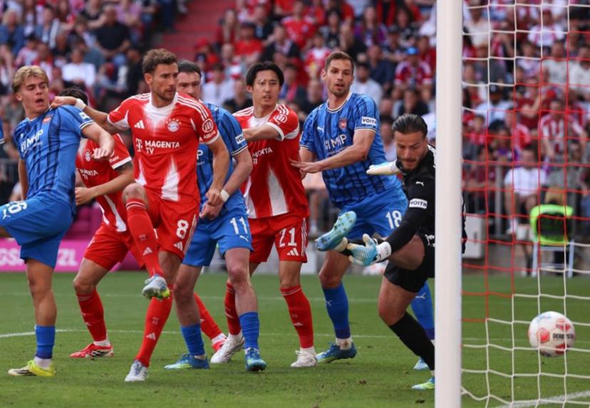 Bayern Munich's German midfielder #08 Leon Goretzka (2L) scores his team's second goal during the German first division Bundesliga football match between FC Bayern Munich and Heidenheim in Munich on May 2, 2026.  Alexandra BEIER / AFP