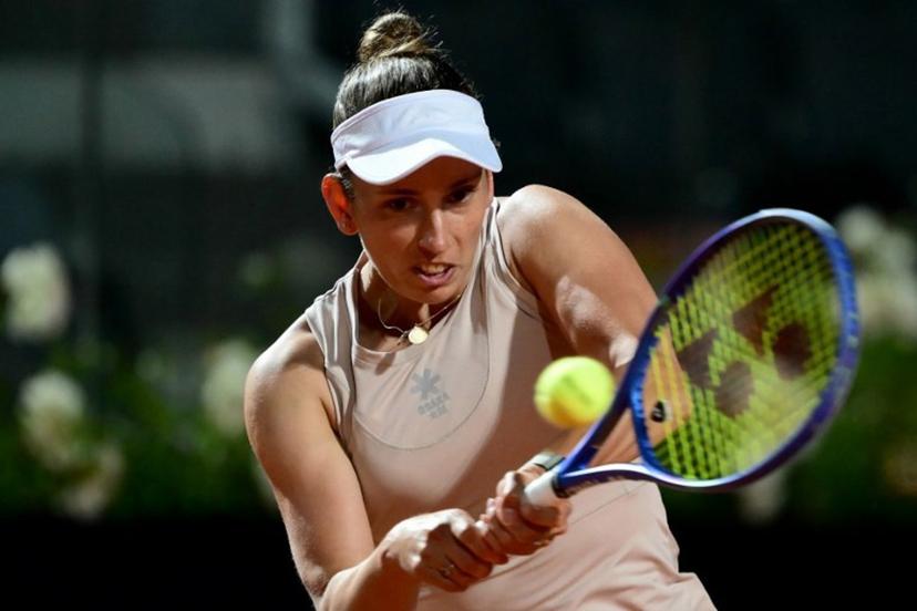 Belgium's Elise Mertens plays a backhand return to US' Jessica Pegula during their women's single match at the WTA Rome Open tennis tournament at Foro Italico in Rome, on May 10, 2025.  Marco BERTORELLO / AFP