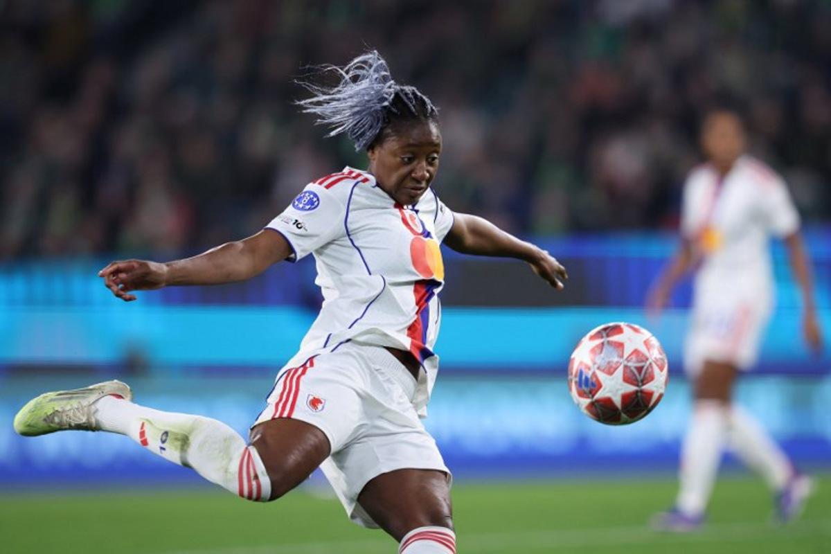 Lyon's French forward #11 Kadidiatou Diani kicks the ball during the UEFA Women's Champions League Quarter final First Leg football match VfL Wolfsburg v Olympique Lyonnais (OL) in Wolfsburg, northern Germany, on March 24, 2026.  Ronny HARTMANN / AFP