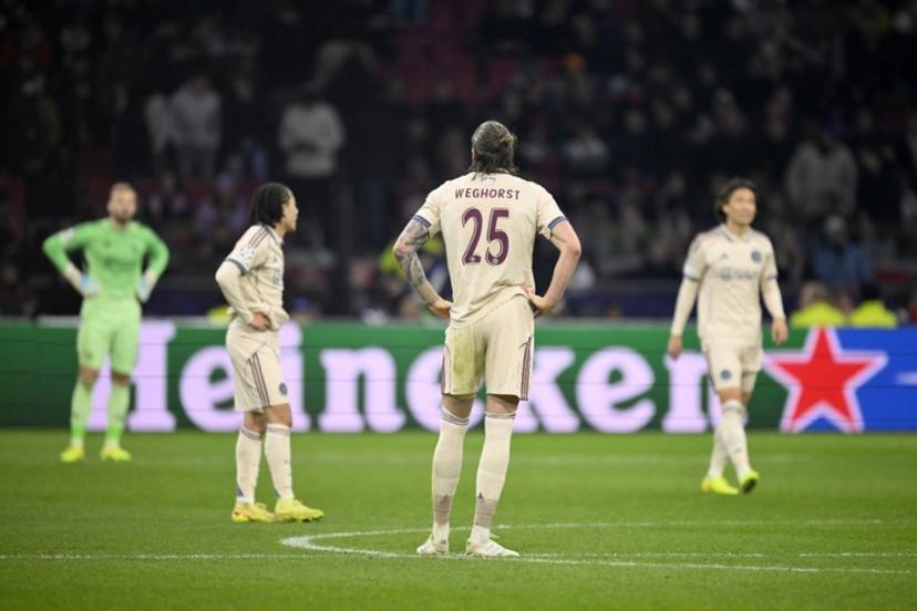 Ajax's Dutch forward #25 Wout Weghorst and team mates react after conceding a goal during the UEFA Champions League, league phase day 5, football match between Ajax and Benfica at the Johan-Cruijff ArenA in Amsterdam on November 25, 2025.  JOHN THYS / AFP
