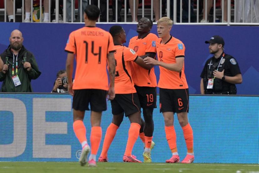Netherlands' forward #19 Brian Brobbey (2nd R) celebrates scoring his team's second goal with defender #06 Jan Paul Van Hecke (R) during the 2026 World Cup Group F football match between Tunisia and the Netherlands at the Kansas City Stadium in Kansas City on June 25, 2026.   Juan MABROMATA / AFP
