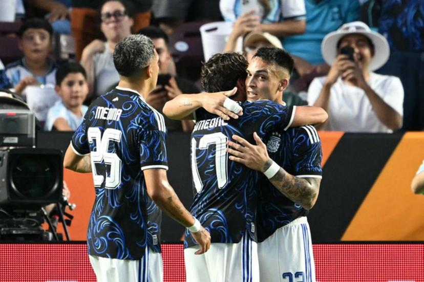 Argentina's forward #22 Lautaro Martinez (R) and Argentina's defender #25 Facundo Medina celebrate with Argentina's forward #17 Giuliano Simeone after he scored a goal during the international friendly football match between Argentina and Honduras at Kyle Field in College Station, Texas on June 6, 2026.  RONALDO SCHEMIDT / AFP