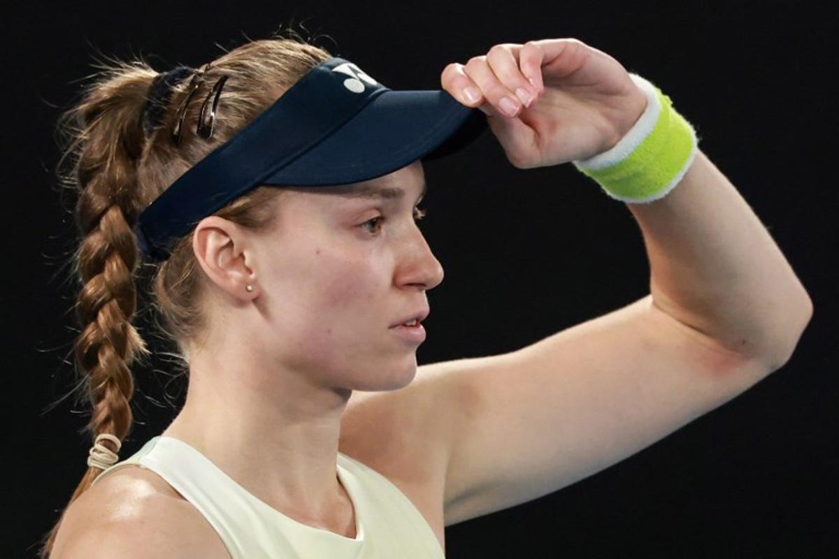 Kazakhstan's Elena Rybakina prepares to play a point against Belarus' Aryna Sabalenka during their women's singles final match on day fourteen of the Australian Open tennis tournament in Melbourne on January 31, 2026.  DAVID GRAY / AFP
