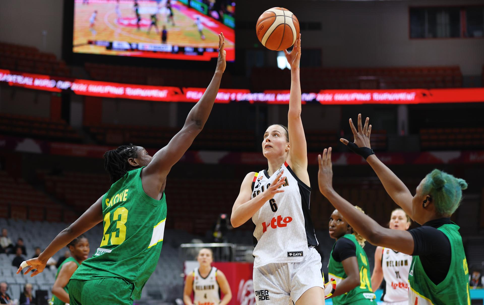 Mali's Sika Kone and Belgium's Antonia Delaere fight for the ball during a basket game between Belgium's national team Belgian Cats and Mali, in Wuhan, China, on Saturday 14 March 2026, the third game (out of 5) of the qualifications phase for the World Cup Basket tournament. BELGA PHOTO NIKOLA KRSTIC