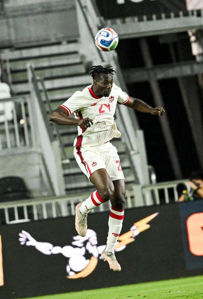 Canada's forward #24 Promise David heads the ball during the international friendly football match between Canada and Venezuela at Chase Stadium in Fort Lauderdale, Florida, on November 18, 2025.  CHANDAN KHANNA / AFP