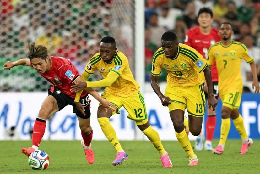 South Korea's midfielder #19 Lee Kang-in (L) tries to control the ball as he's defended by South Africa's forward #12 Thapelo Maseko and South Africa's midfielder #13 Sphephelo Sithole during the 2026 World Cup Group A football match between South Africa and South Korea at the Monterrey Stadium in Guadalupe, Mexico, on June 24, 2026.   Yuri CORTEZ / AFP