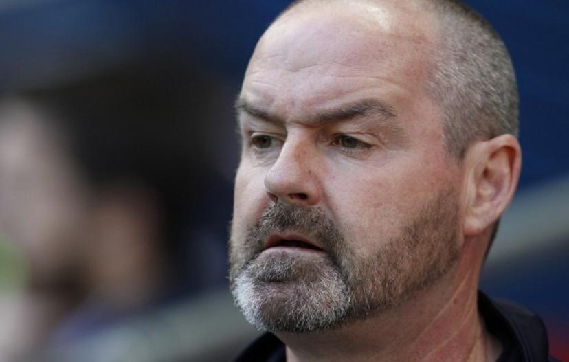 Reading's manager Steve Clarke sits prior to the start of the FA Cup semi-final between Arsenal and Reading at Wembley stadium in London on April 18, 2015. AFP PHOTO / IAN KINGTON NOT FOR MARKETING OR ADVERTISING USE / RESTRICTED TO EDITORIAL USE  IAN KINGTON / AFP