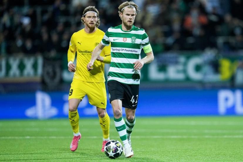 Sporting Lisbon's Danish midfielder #42 Morten Hjulmand and Bodo/Glimt's Danish forward #09 Kasper Waarst Hogh vie for the ball during the UEFA Champions League, Last 16, first-leg football match Bodo/Glimt vs Sporting CP at the Aspmyra stadium, in Bodo, Norway on March 11, 2026.    Fredrik Varfjell / NTB / AFP