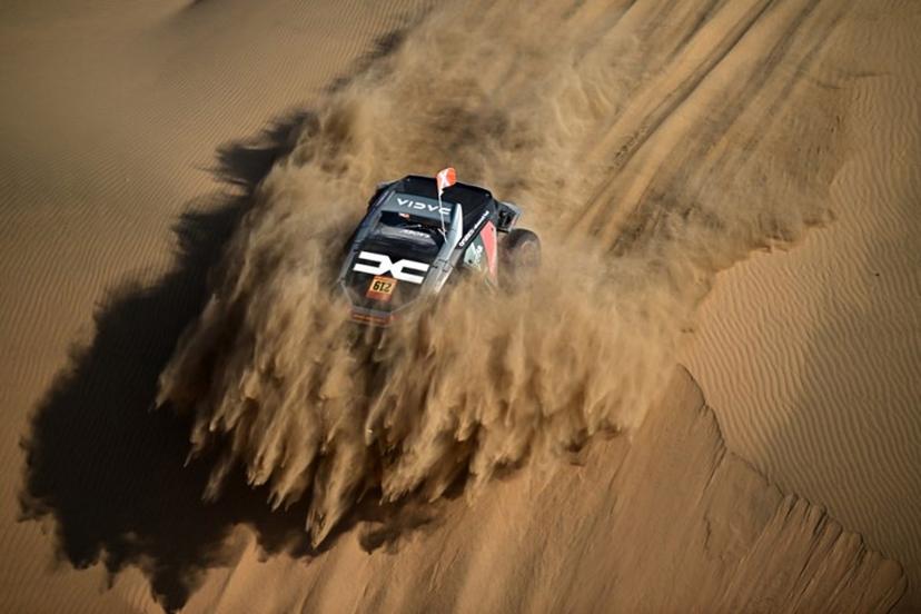 The Dacia Sandriders's French driver Sebastien Loeb and French co-pilot Edouard Boulanger compete in Stage 10 of the 48th edition of the Dakar Rally 2026, between Bisha and Bisha, Saudi Arabia, on January 14, 2026.  Giuseppe CACACE / AFP