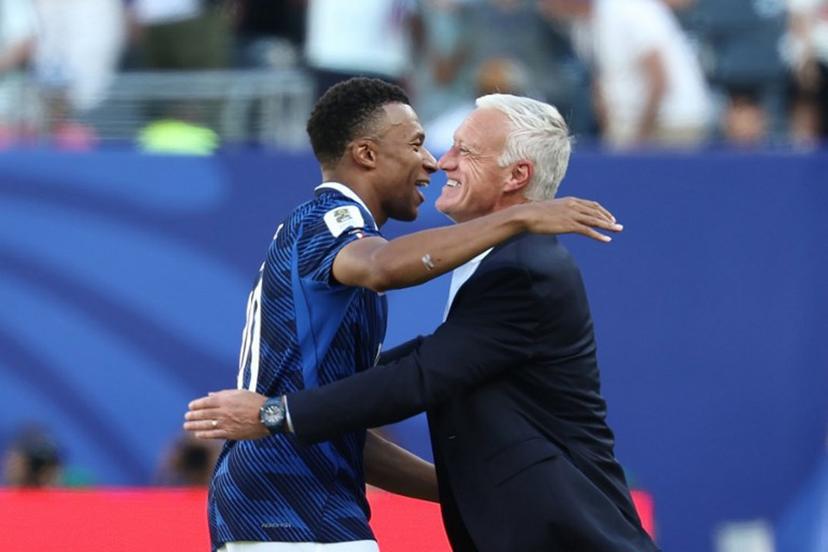 France's head coach Didier Deschamps congratulates his forward #10 Kylian Mbappe after scoring his team's first goal during the 2026 World Cup Group I football match between France and Senegal at the New York/New Jersey Stadium in East Rutherford on June 16, 2026.   FRANCK FIFE / AFP