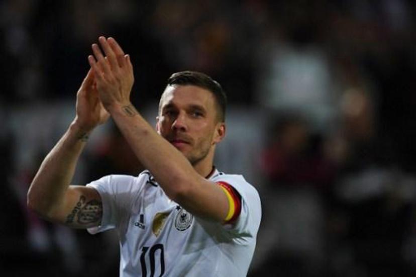 Germany's midfielder Lukas Podolski greets fans after a friendly football match between Germany and England on March 22, 2017 in Dortmund, western Germany.  It is Lukas Podolski's last match with the German team. PATRIK STOLLARZ / AFP