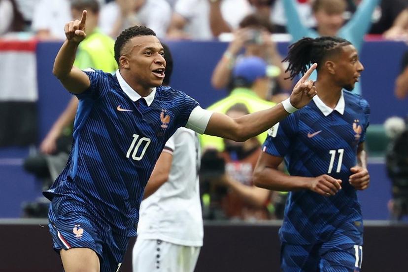 France's forward #10 Kylian Mbappe celebrates scoring his team's first goal during the 2026 World Cup Group I football match between France and Iraq at the Philadelphia Stadium in Philadelphia on June 22, 2026.   FRANCK FIFE / AFP