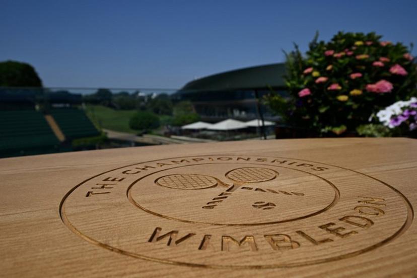 A table top engraved with the Wimbledon logo is pictured at The All England Lawn Tennis and Croquet Club in Wimbledon, southwest London, on June 24, 2026, ahead of the 2026 Wimbledon Championships.  Glyn KIRK / AFP