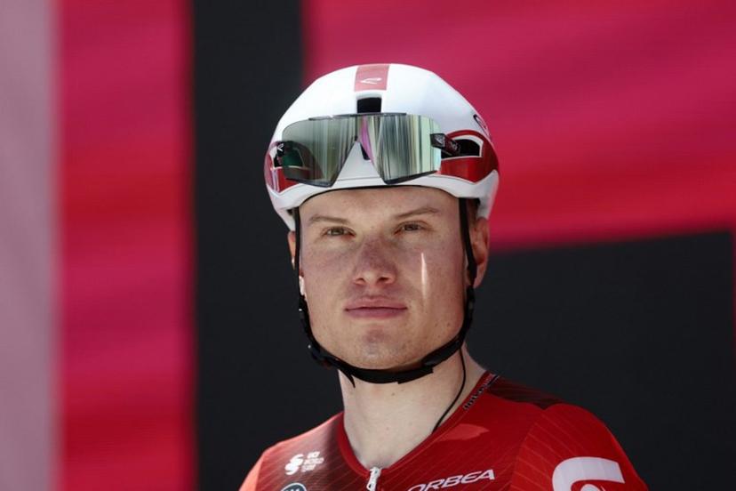 Lotto Intermarche Belgian rider Lennert Van Eetvelt stands on the signature podium before the 8th stage of the Giro d'Italia 2026 - Tour of Italy cycling race between Chieti and Fermo, central Italy on May 16, 2026.  Luca Bettini / AFP