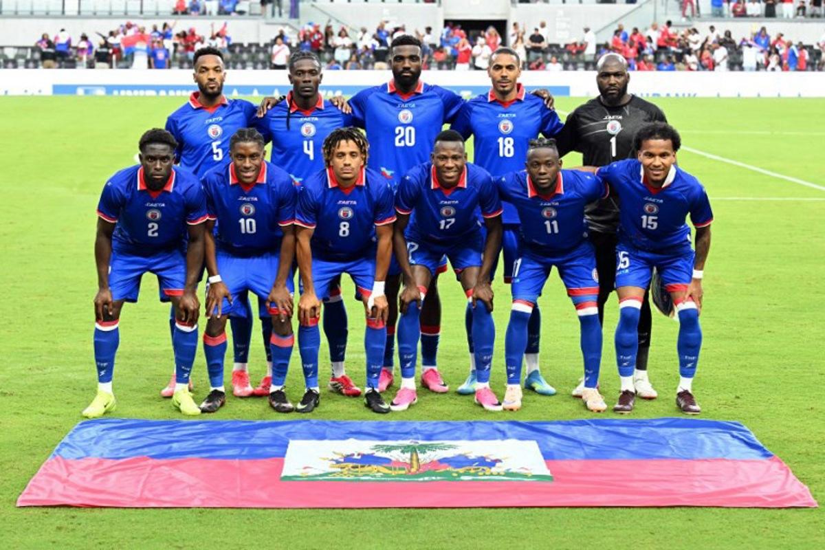 The Haiti national team pose for a photo before the start of an international friendly football match between Haiti and Peru at Nu Stadium in Miami, Florida on June 5, 2026.  CHANDAN KHANNA / AFP