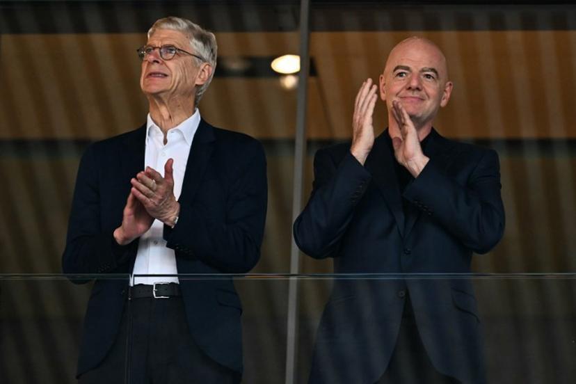 Former Arsenal's French manager Arsene Wenger (L) and FIFA President Gianni Infantino  applaud ahead of the UEFA Women's Euro 2025 quarter-final football match between Sweden and England at Letzigrund Stadium in Zurich, on July 17, 2025.  Fabrice COFFRINI / AFP