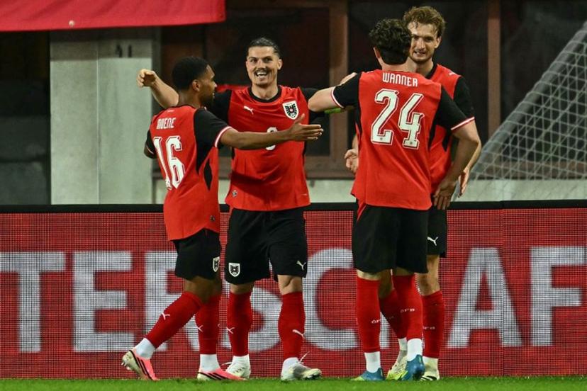 Austria's forward #09 Marcel Sabitzer (2nd L) celebrates scoring the opening goal with his teammates during the friendly football match between Austria and Tunisia in Vienna, Austria on June 1, 2026 ahead of the 2026 FIFA World Cup football tournament.  Joe Klamar / AFP
