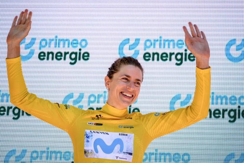 Switzerland's Marlen Reusser wearing the overall leader's yellow jersey celebrates on the podium after winning in the fourth stage, a 23,7 km time trial from Aarburg to Aarburg, at the Women's Tour of Switzerland (Tour de Suisse) cycling race in Aarburg, Switzerland, on June 20, 2026.  Fabrice COFFRINI / AFP