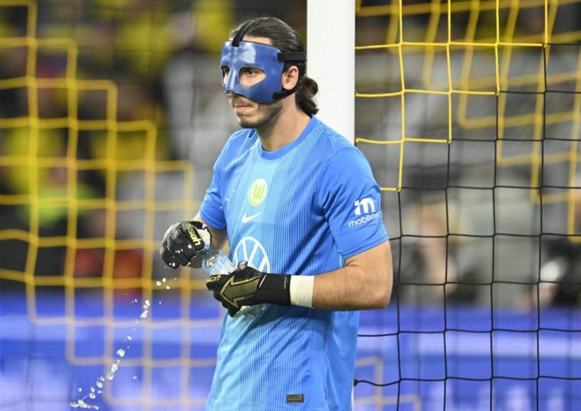 Wolfsburg's Polish goalkeeper #01 Kamil Grabara looks on during the German first division Bundesliga football match between Borussia Dortmund and VfL Wolfsburg in Dortmund on September 21, 2025.  INA FASSBENDER / AFP