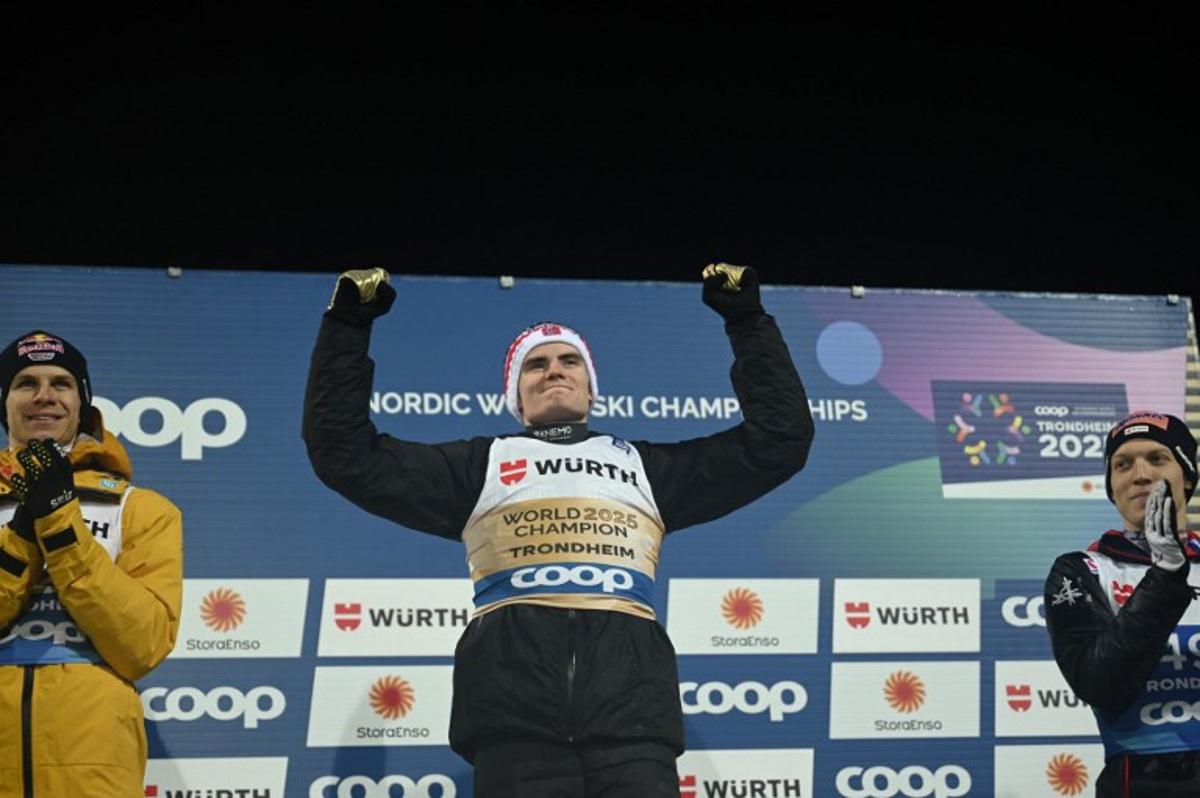 (L-R) Second placed Germany's Andreas Wellinger, winner Norway's Marius Lindvik and Austria's Jan Hoerl celebrate on the podium after the men's normal Hill HS102 event at the FIS Ski Jumping World Championships in Trondheim, Norway on March 2 2025.  Jonathan NACKSTRAND / AFP