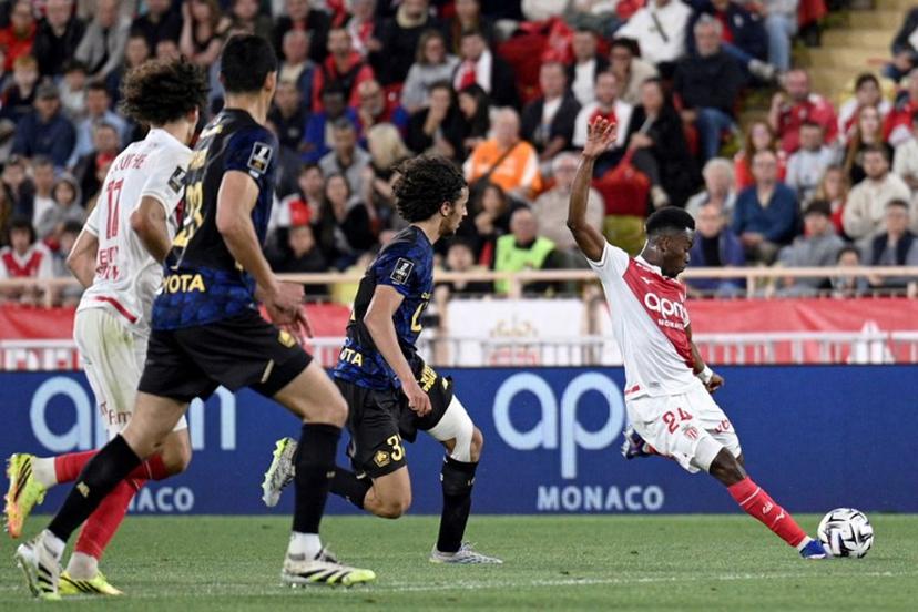 Monaco's Ivorian forward #24 Simon Adingra (R) kicks the ball in an attempt to score during the French L1 football match between Monaco (ASM) and Lille (LOSC) at the Louis II Stadium (Stade Louis II) in the Principality of Monaco on May 10, 2026.  Frederic DIDES / AFP