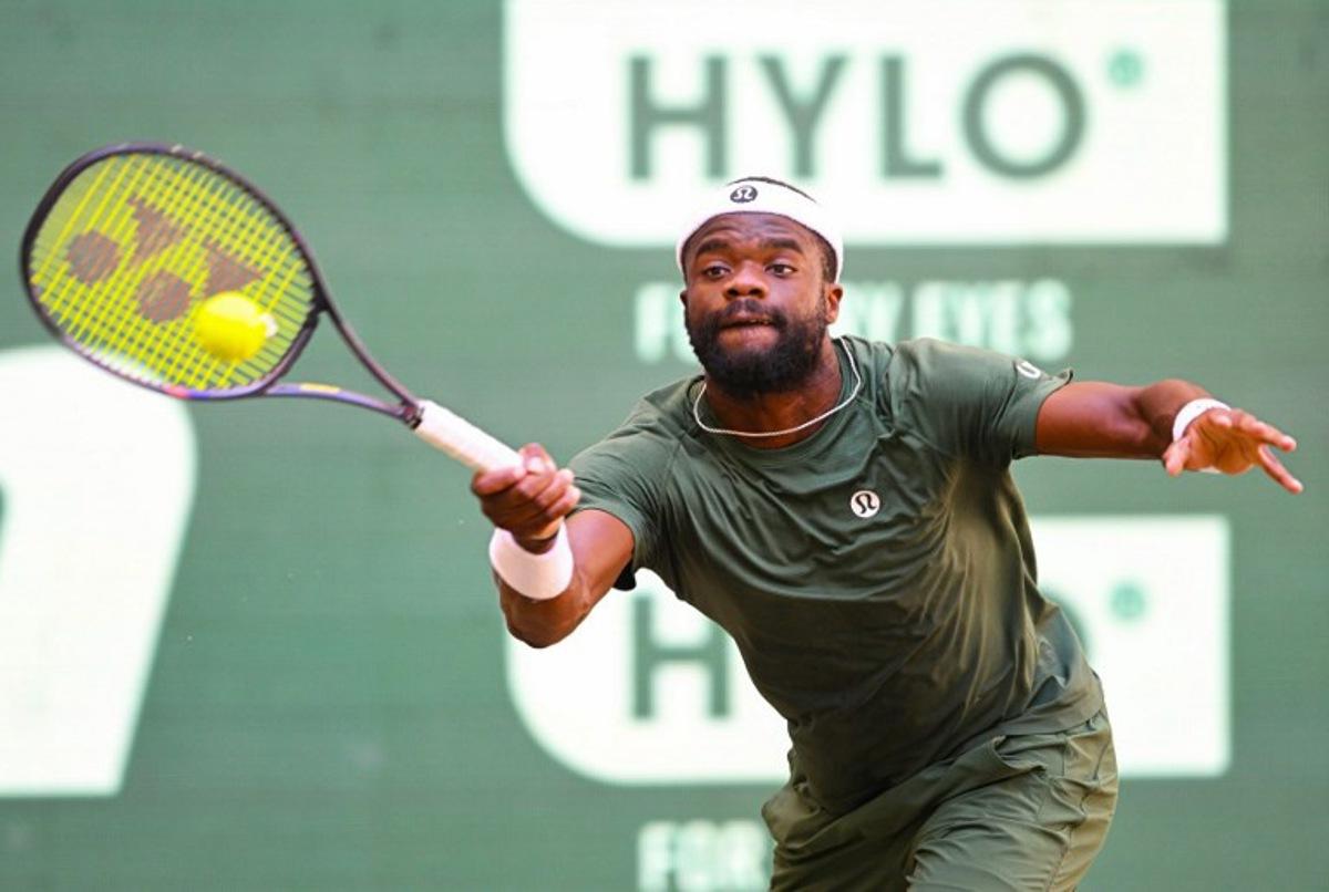 Frances Tiafoe of the US returns the ball to his compatriot Taylor Fritz during the men's singles final match of the Halle Open ATP tennis tournament in Halle, western Germany, on June 21, 2026.  CARMEN JASPERSEN / AFP