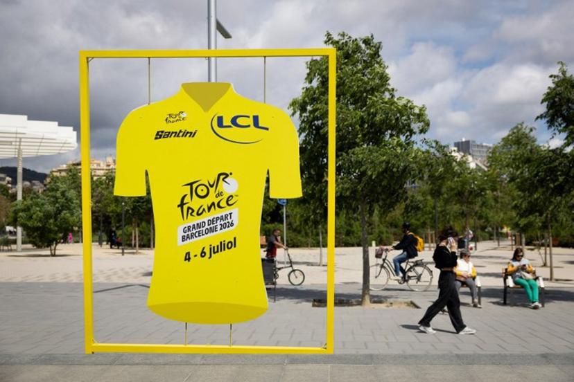 A display shaped like the Tour de France leader's yellow jersey promoting the race's 'Grand Depart' is pictured in Barcelona on May 7, 2026. The 2026 Tour de France cycling race's Grand Depart first stage will be held in Barcelona on July 4, 2026 with Spain's north eastern Catalonia region also hosting the second and third stages of La Grand Boucle. Josep LAGO / AFP