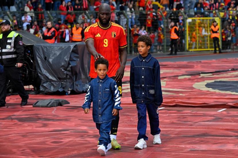Belgium's forward #9 Romelu Lukaku walks around the stadium with his children after the international friendly football match between Belgium and Tunisia at the King Baudouin Stadium in Brussels on June 6, 2026.  JOHN THYS / AFP