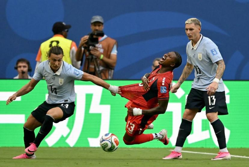 Cape Verde's defender #13 Sidney Lopes Cabral, Uruguay's forward #14 Agustin Canobbio and defender #13 Guillermo Varela fight for the ball during the 2026 World Cup Group H football match between Uruguay and Cape Verde at the Miami Stadium in Miami Gardens on June 21, 2026.   CHANDAN KHANNA / AFP