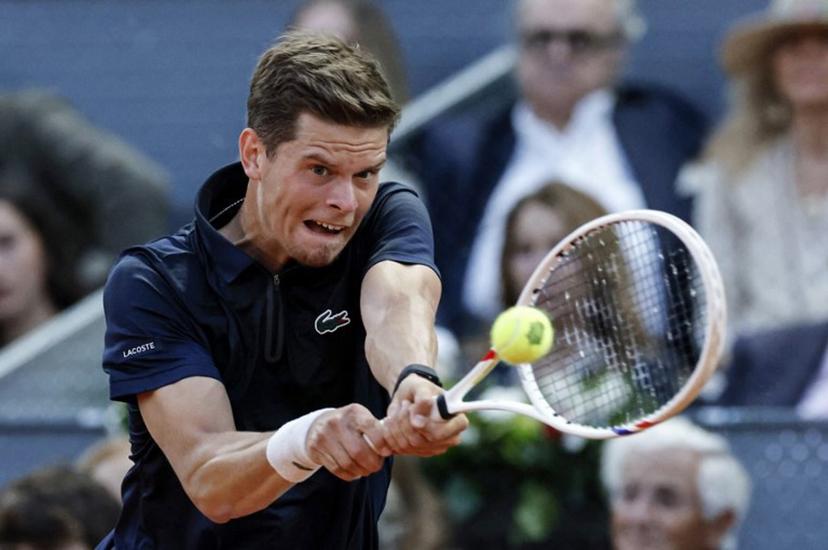 Belgium's Alexander Blockx returns the ball to Germany's Alexander Zverev during their 2026 ATP Tour Madrid Open tennis tournament semi-final singles match at the Caja Magica in Madrid, on May 1, 2026.  OSCAR DEL POZO / AFP