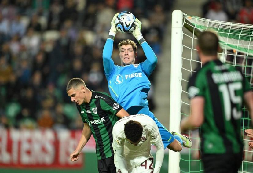 Muenster's goalkeeper #40 Johannes Schenk makes a save during the German Cup (DFB Pokal) first round football match SC Preussen Muenster 06 v FC Bayern Munich in Muenster, western Germany, on September 26, 2023.  INA FASSBENDER / AFP