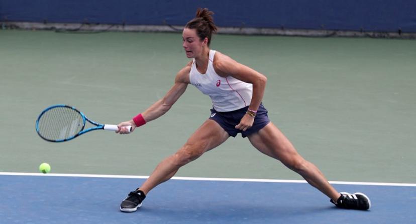 France's Lois Boisson returns the ball to Switzerland's Viktorija Golubic during their women's singles first round tennis match on day three of the US Open tennis tournament at the USTA Billie Jean King National Tennis Center in New York City, on August 26, 2025.  TIMOTHY A. CLARY / AFP