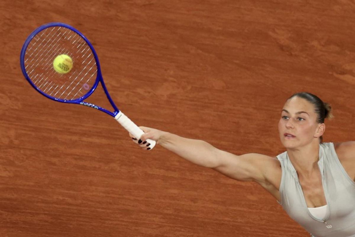 Ukraine's Marta Kostyuk plays a forehand return to Ukraine's Elina Svitolina during their women's quarter final singles match on day 10 of the French Open tennis tournament on Court Philippe-Chatrier at the Roland-Garros Complex in Paris on June 2, 2026.  ALAIN JOCARD / AFP