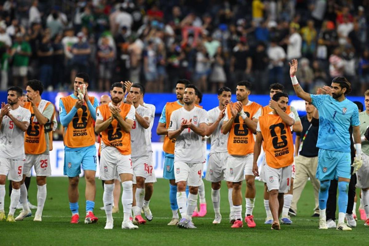 Iran's players greet supporters after the 2026 World Cup Group G football match between Iran and New Zealand at Los Angeles Stadium in Inglewood on June 15, 2026.   Patrick T. Fallon / AFP