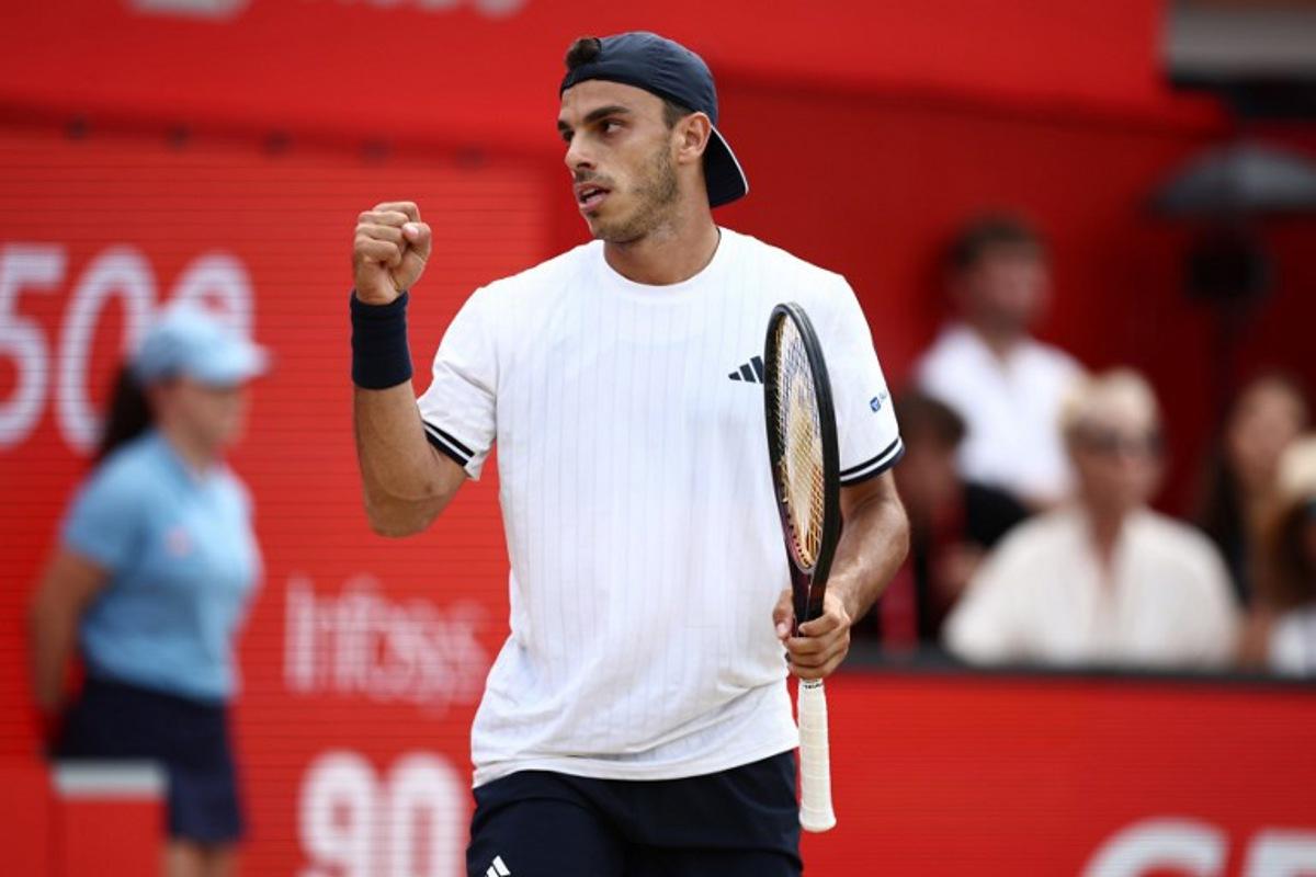 Argentina's Francisco Cerundolo reacts after winning the second set against US player Tommy Paul during the men's singles final tennis match on day six of the ATP HSBC Championships at Queen's Club in west London on June 21, 2026.  Henry Nicholls / AFP