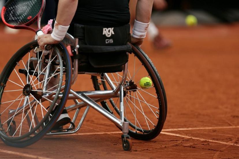 This photograph shows a ball stuck in the spokes of the wheelchair of Netherlands' Aniek Van Koot as she plays against Japan's Yui Kamiji during their women's wheelchair singles final match on day 14 of the French Open tennis tournament on Court Suzanne-Lenglen at the Roland-Garros Complex in Paris on June 7, 2025.  Alain JOCARD / AFP